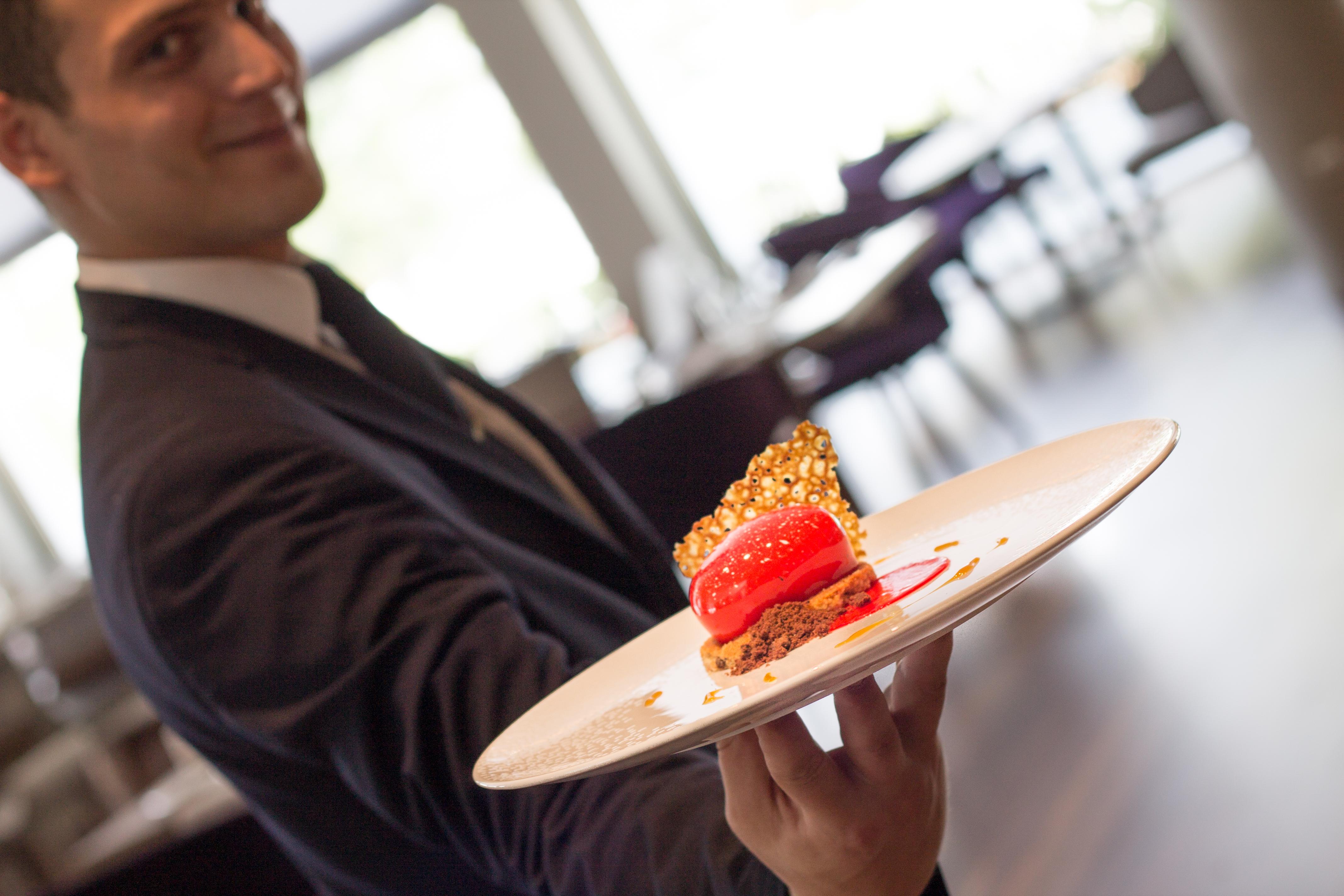Makedonia Palace Thessaloniki Exterior photo A waiter serving a dessert
